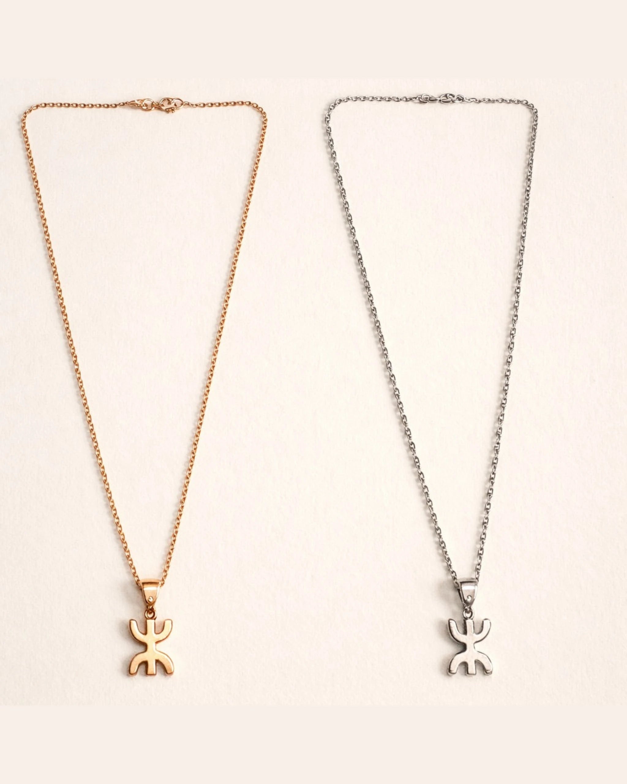 Amzay Yaz pendant necklace in gold and silver finish, 40cm chain with Amazigh symbol.