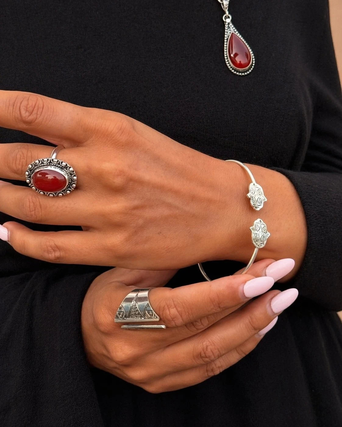 Tarra adjustable sterling silver ring featuring a central black natural onyx stone with Berber engravings.
