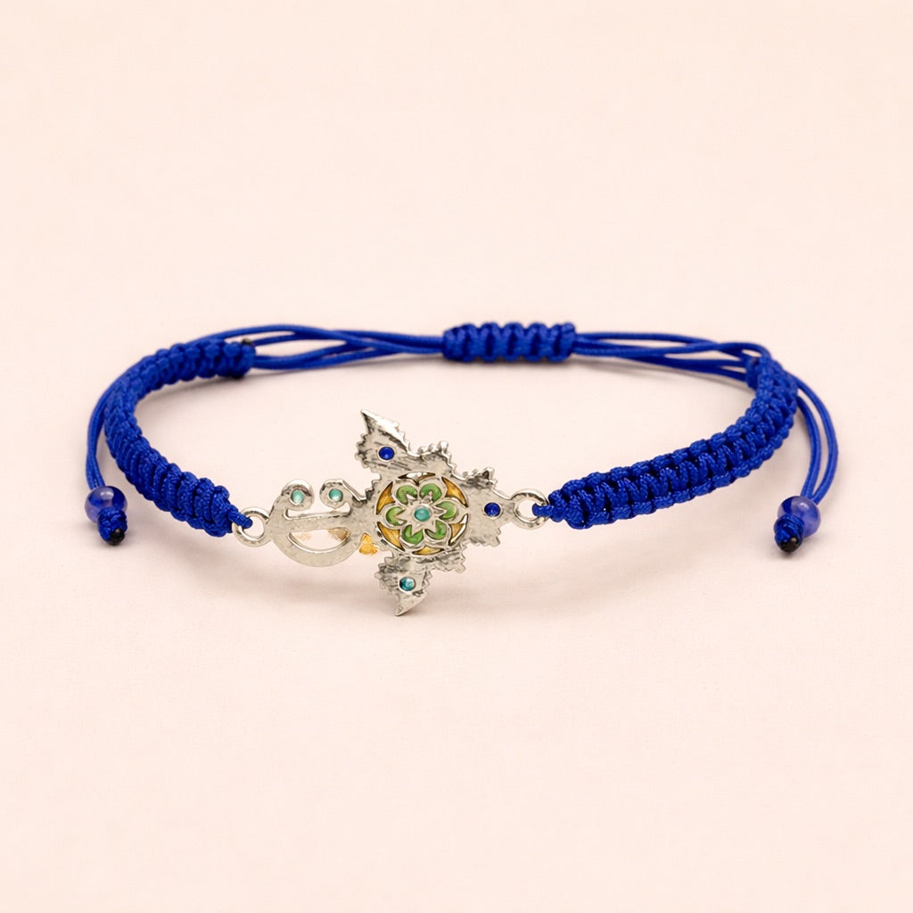 Zirzita adjustable cord bracelet with an artisan-crafted Moroccan silver Amazigh fibula charm.