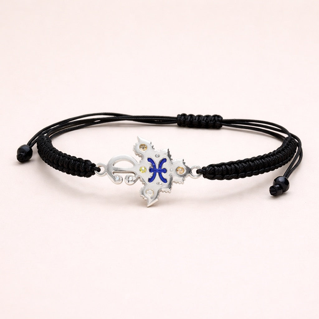 Zirzita adjustable cord bracelet with an artisan-crafted Moroccan silver Amazigh fibula charm.