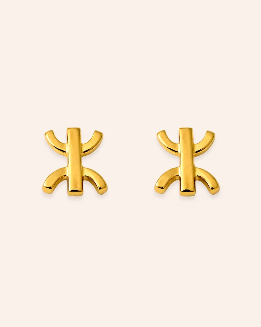 Azura Yaz stud earrings in gold plating, featuring the Tifinagh Yaz symbol for freedom and Amazigh identity.