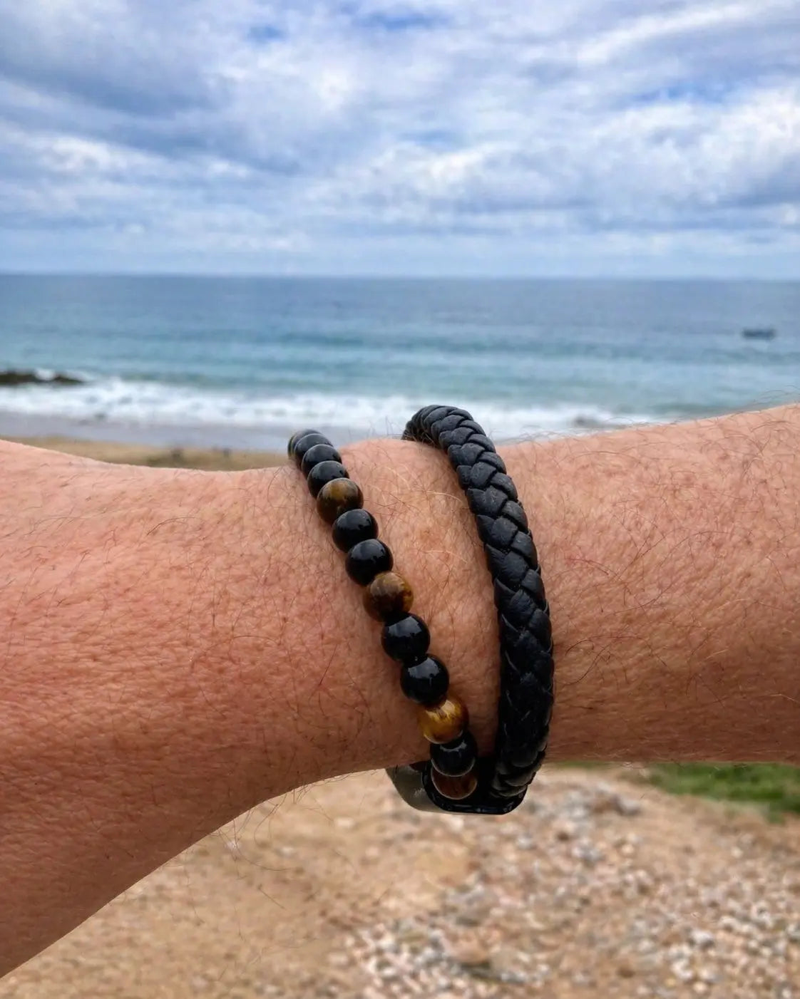 Imzzu unisex braided leather bracelet featuring brown Tiger Eye natural stones with a magnetic clasp.