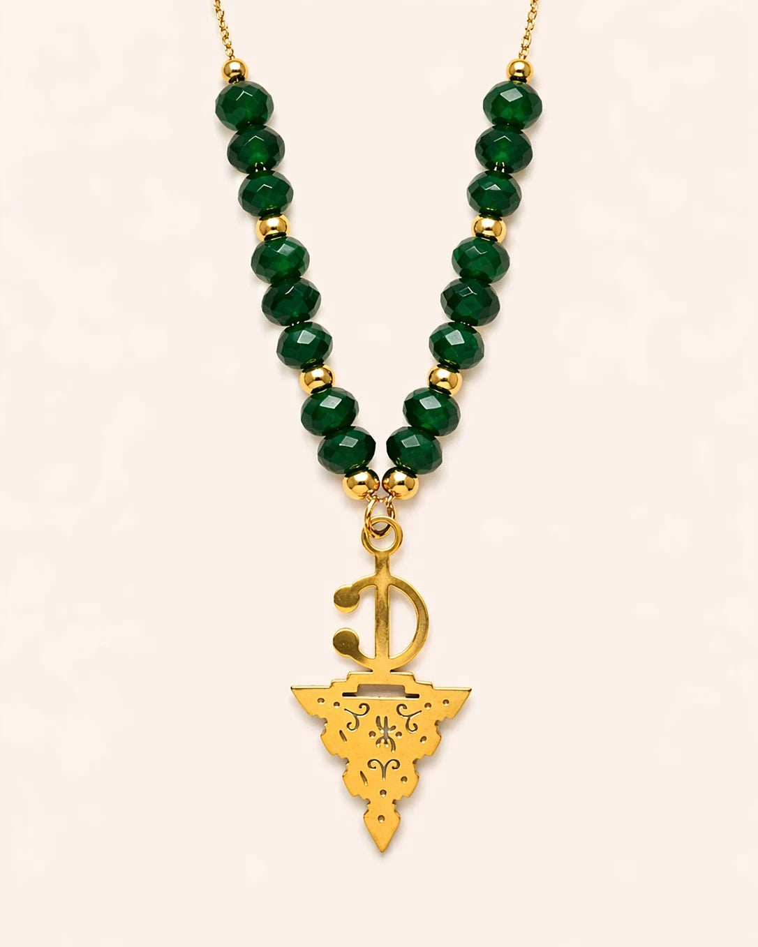 Maisa Amazigh-inspired statement necklace with red beads and a silver-toned fibula pendant on stainless steel.