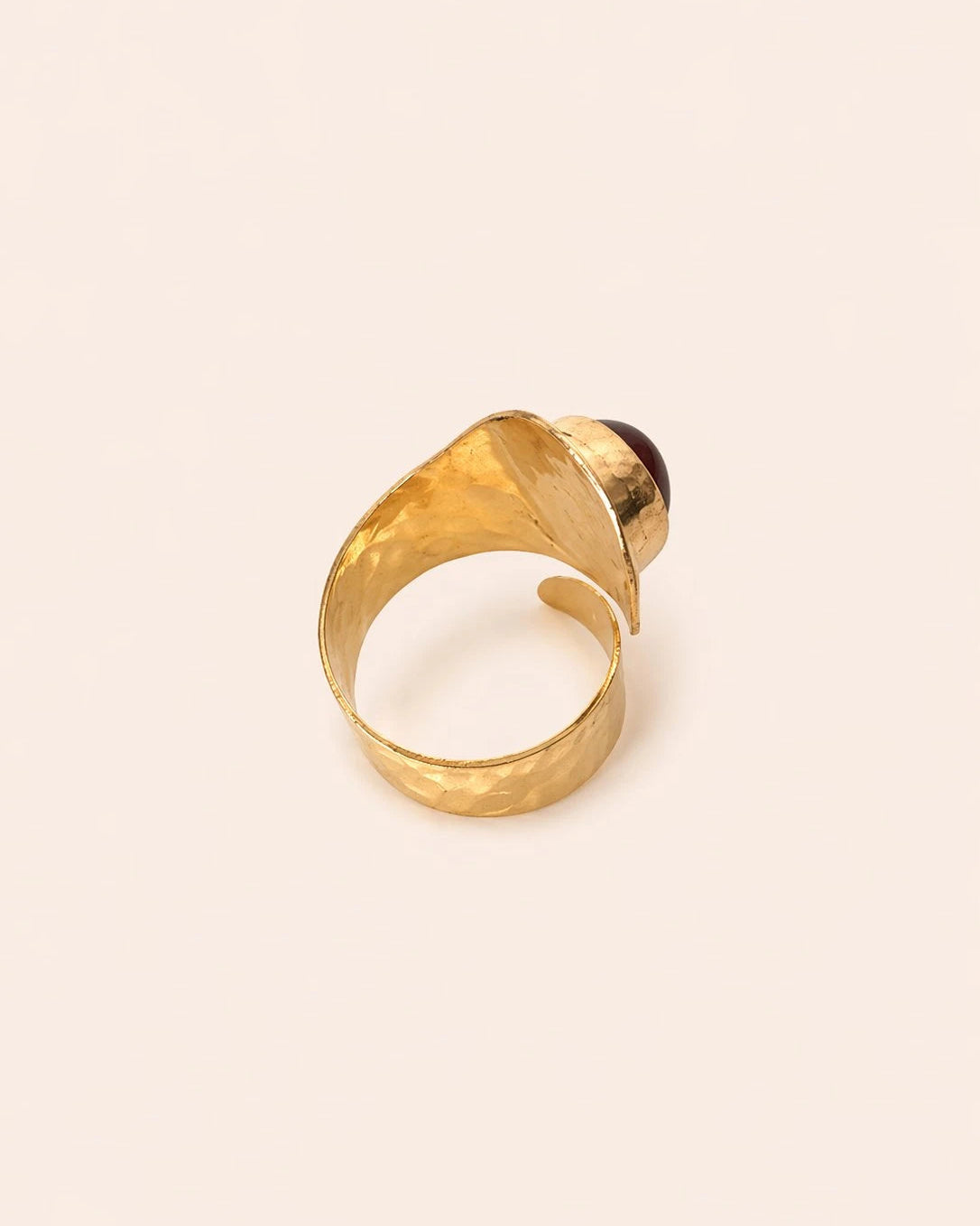 Back view of hand-forged amazigh brass spiral statement ring
