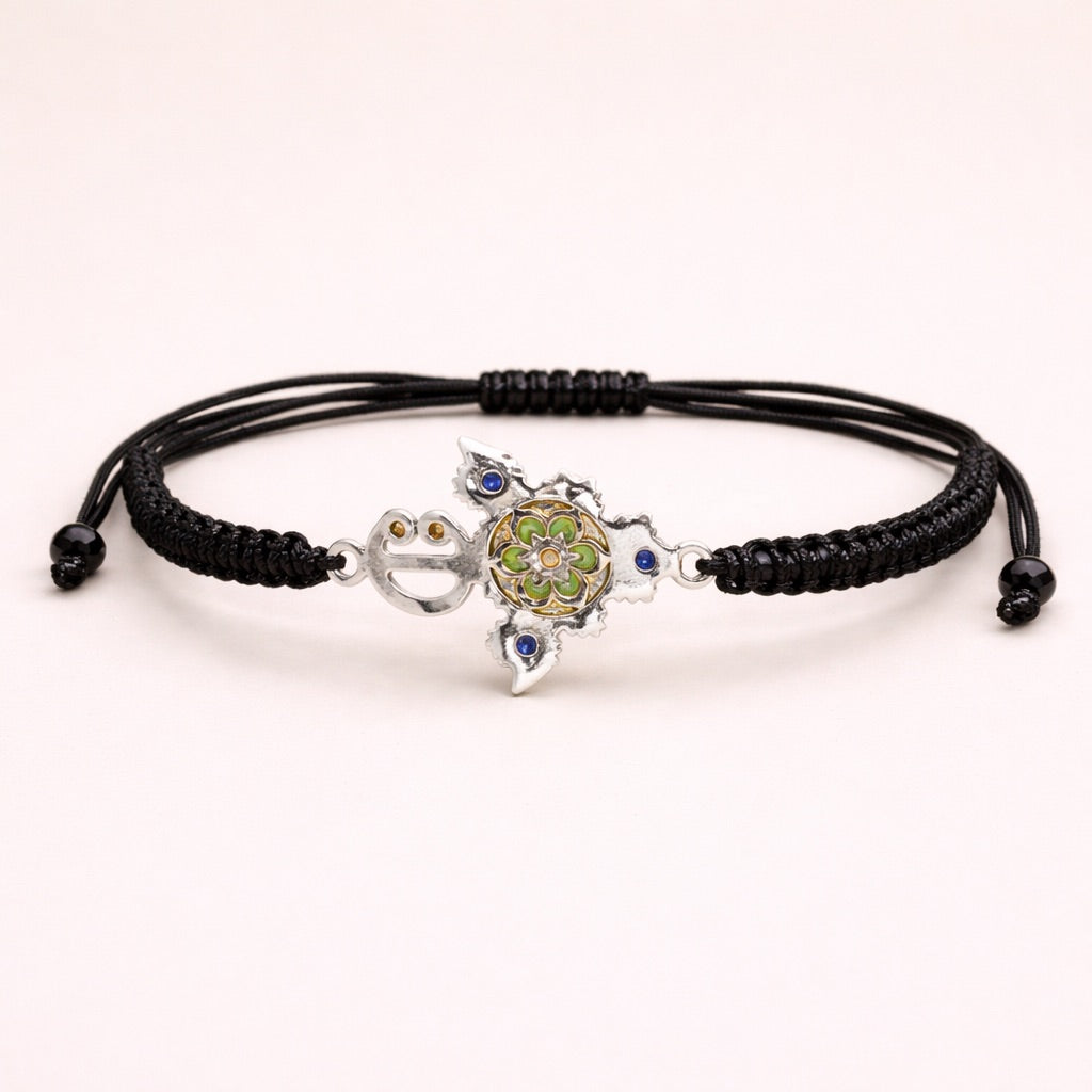 Zirzita adjustable cord bracelet with an artisan-crafted Moroccan silver Amazigh fibula charm.