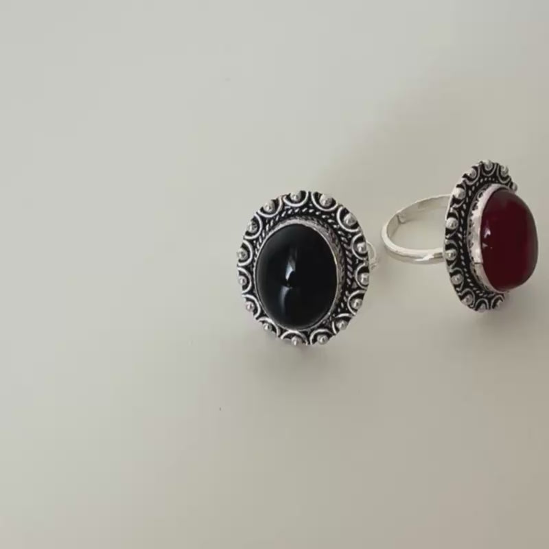 Tarra adjustable sterling silver ring featuring a central black natural onyx stone with Berber engravings.